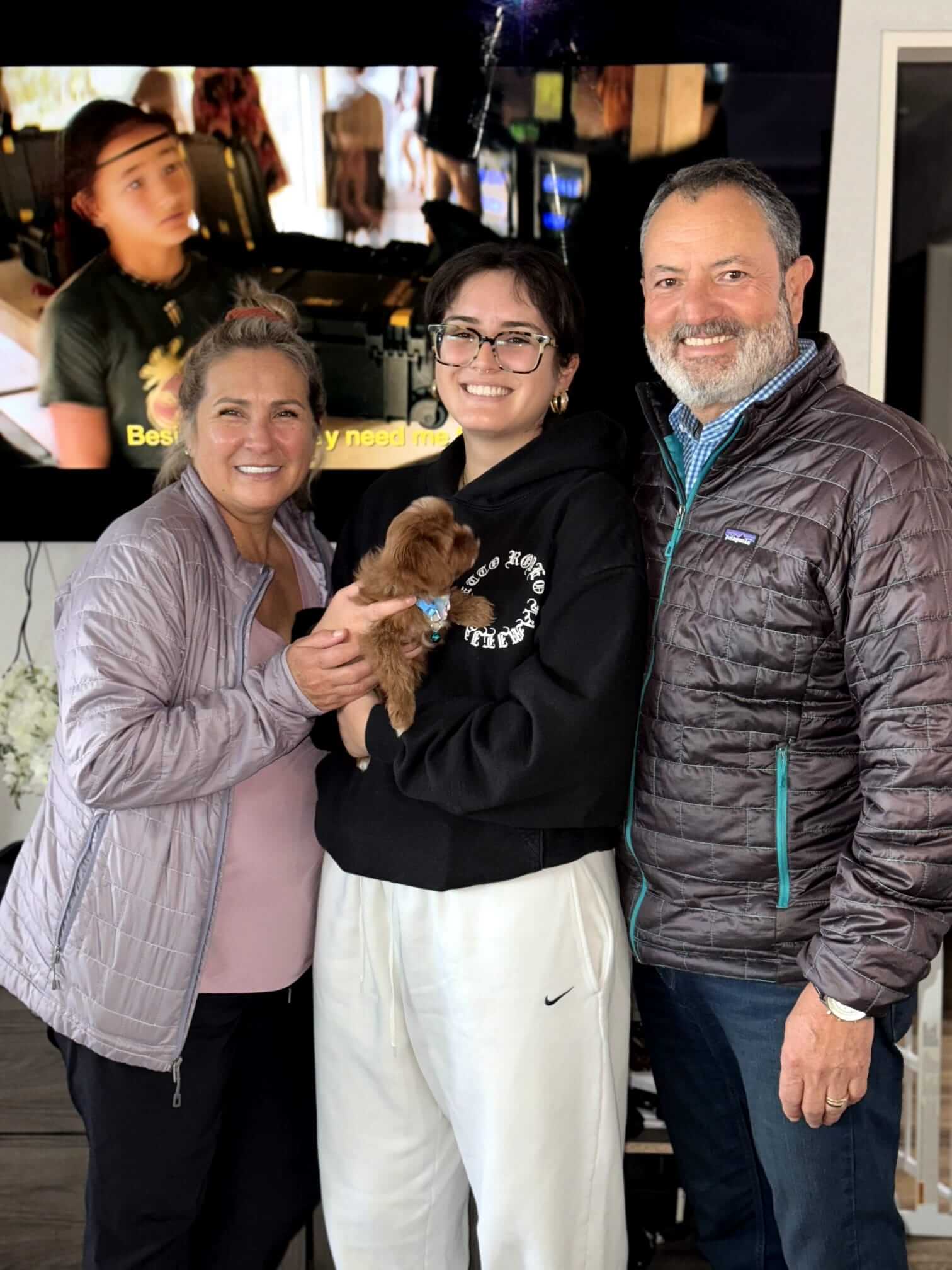 happy family with a small dog