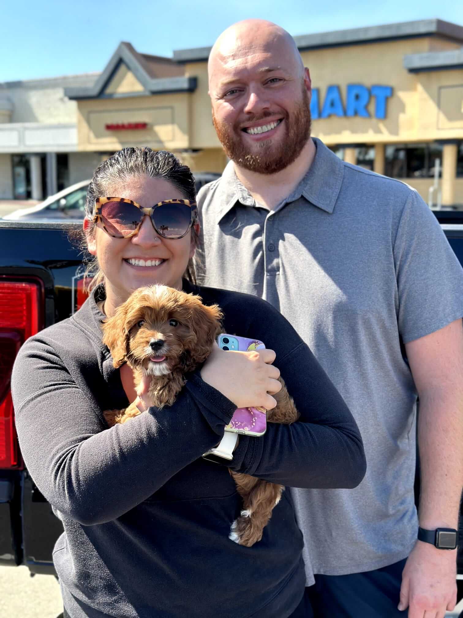 family happy with a toy poodle