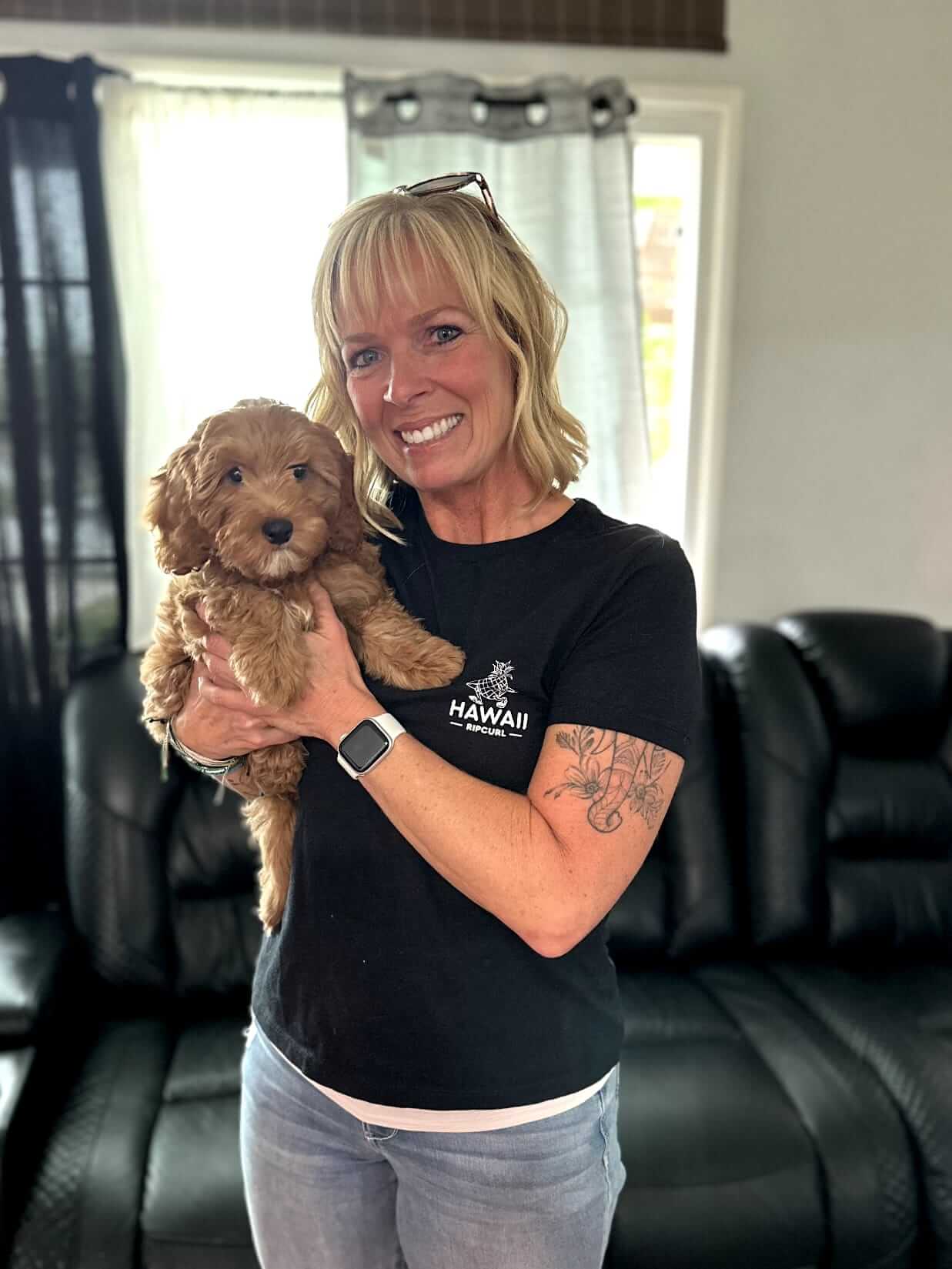 woman happy with a toy poodle